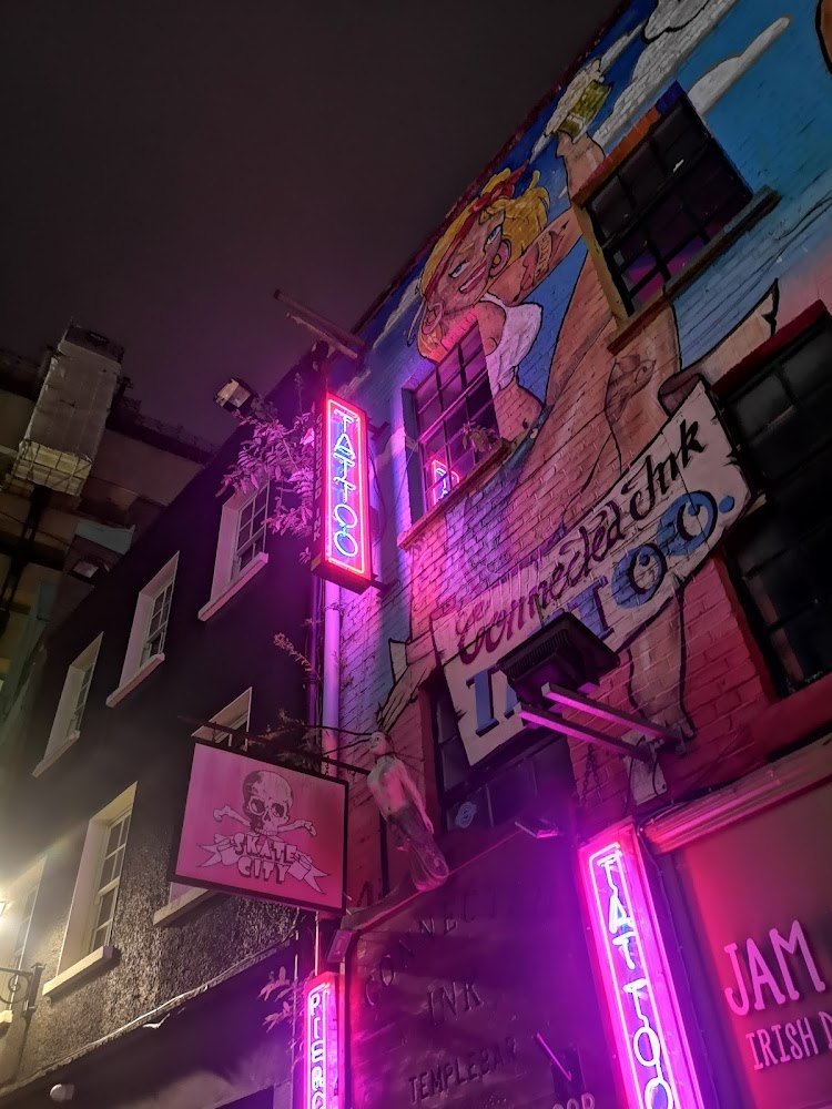 Connected Ink tattoo shopfront on Crown Alley, Temple Bar, with neon tattoo signs